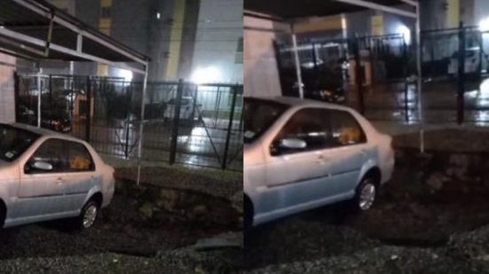 Carro ficou preso na cratera que se formou no estacionamento | Foto: Reprodução