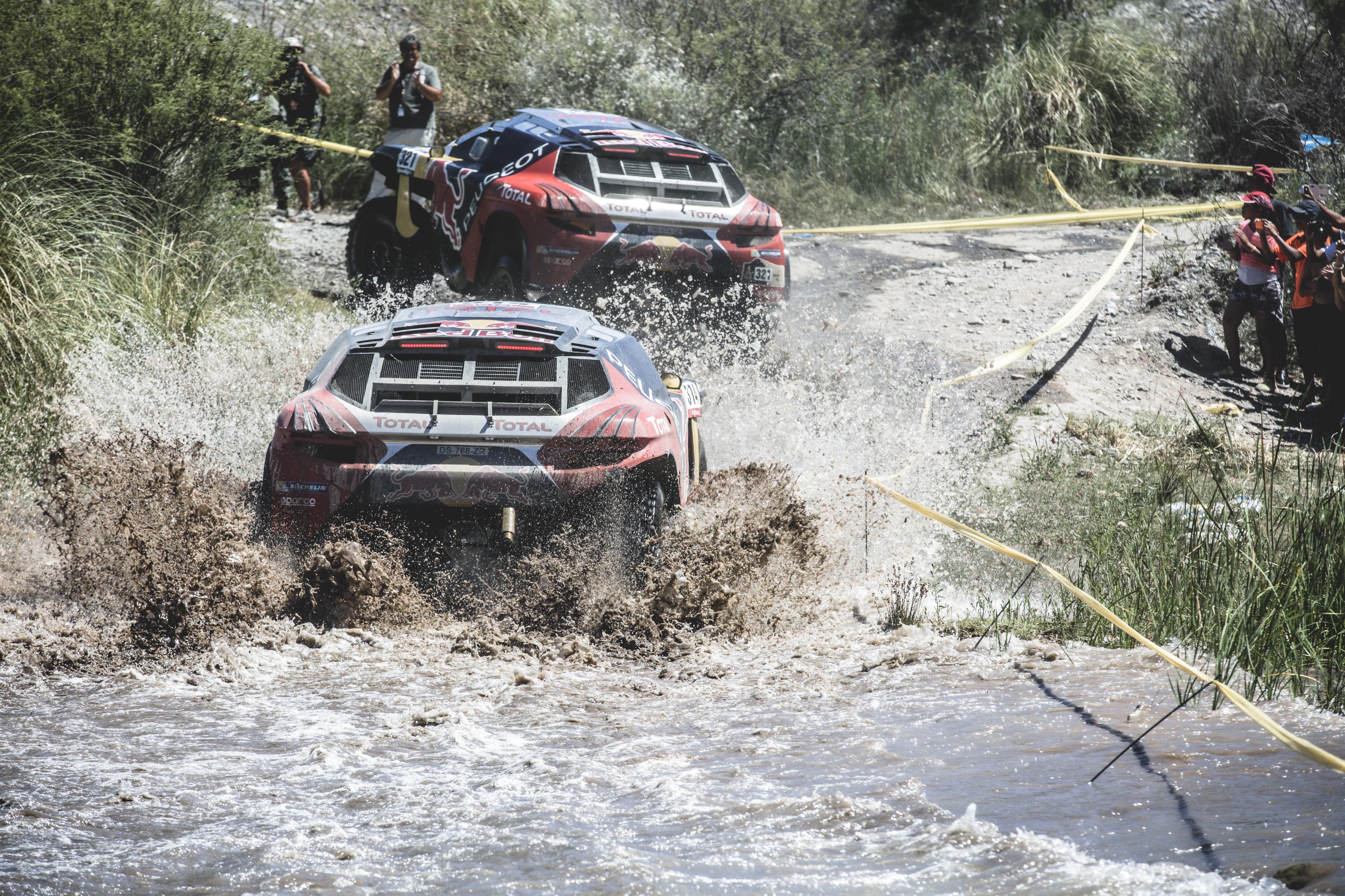 Sebastien Loeb (FRA) from Team Peugeot Total is towed by Cyril Despres (FRA) during stage 11 of Rally Dakar 2016 from La Rioja to San Juan, Argentina on January 14, 2016.